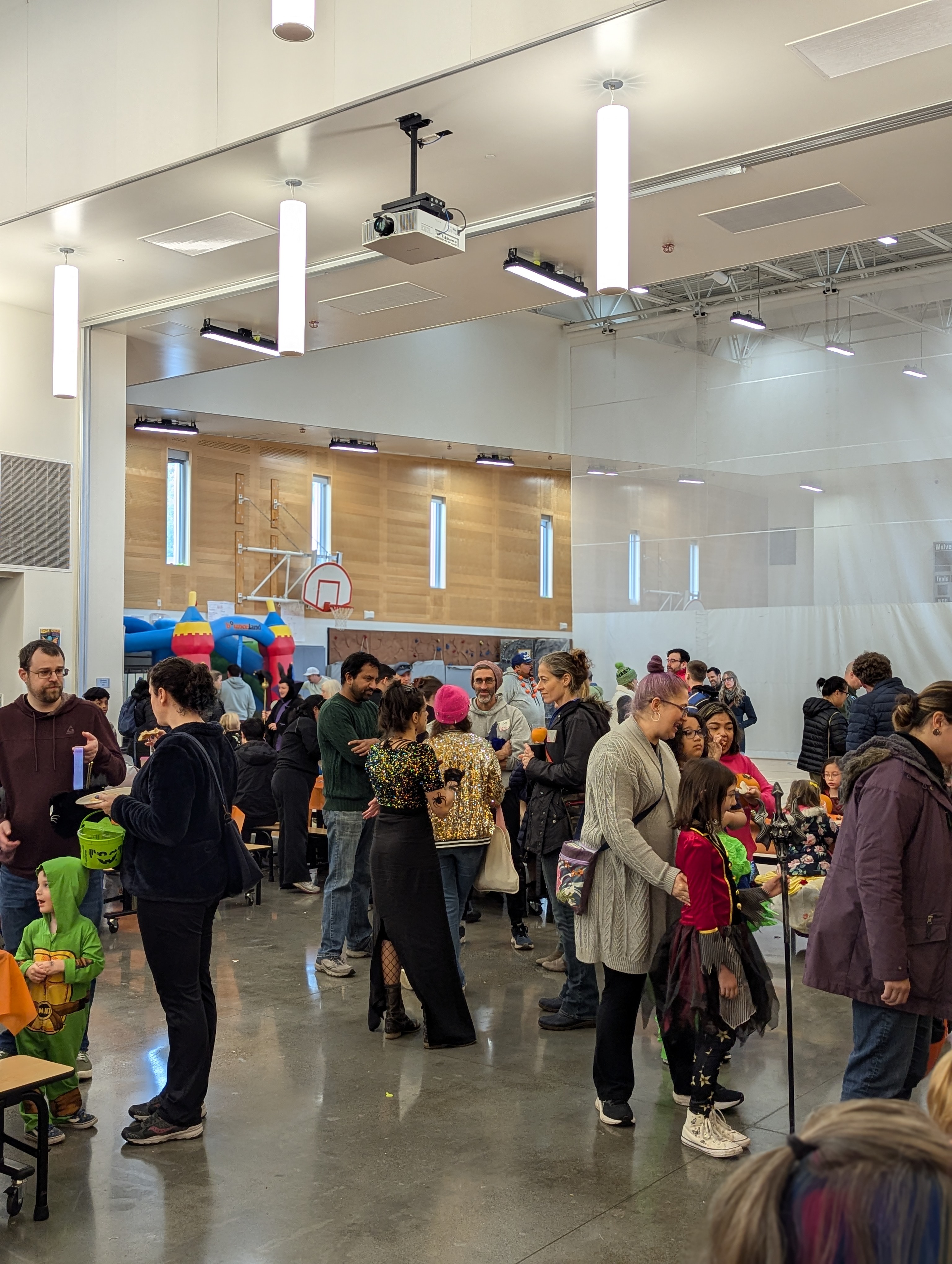 Attendees stand and chat during the Harvest Festival.