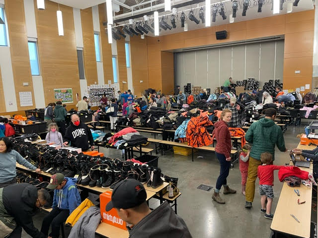 Shoppers wander the cafeteria for winter gear.