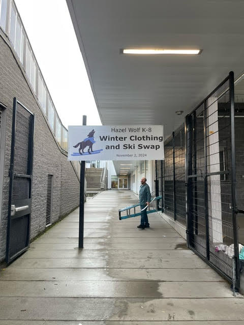 Winter Clothing and Ski Swap sign hang at the entrance of the cafeteria.