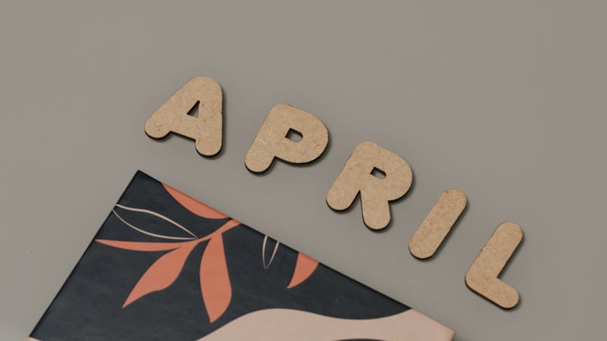 April spelled out on a brown background.