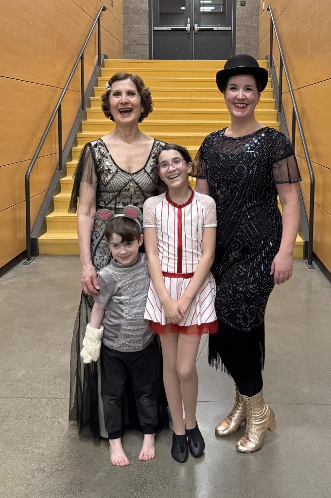 Laney stands in the middle beside her grandmother, mother, and brother, all in costume.